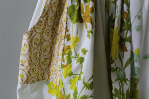 Close-up of floral-patterned fabric swatches on a gray background