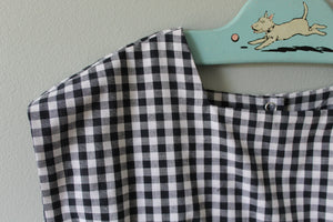 Black and white checkered fabric on a hanger.