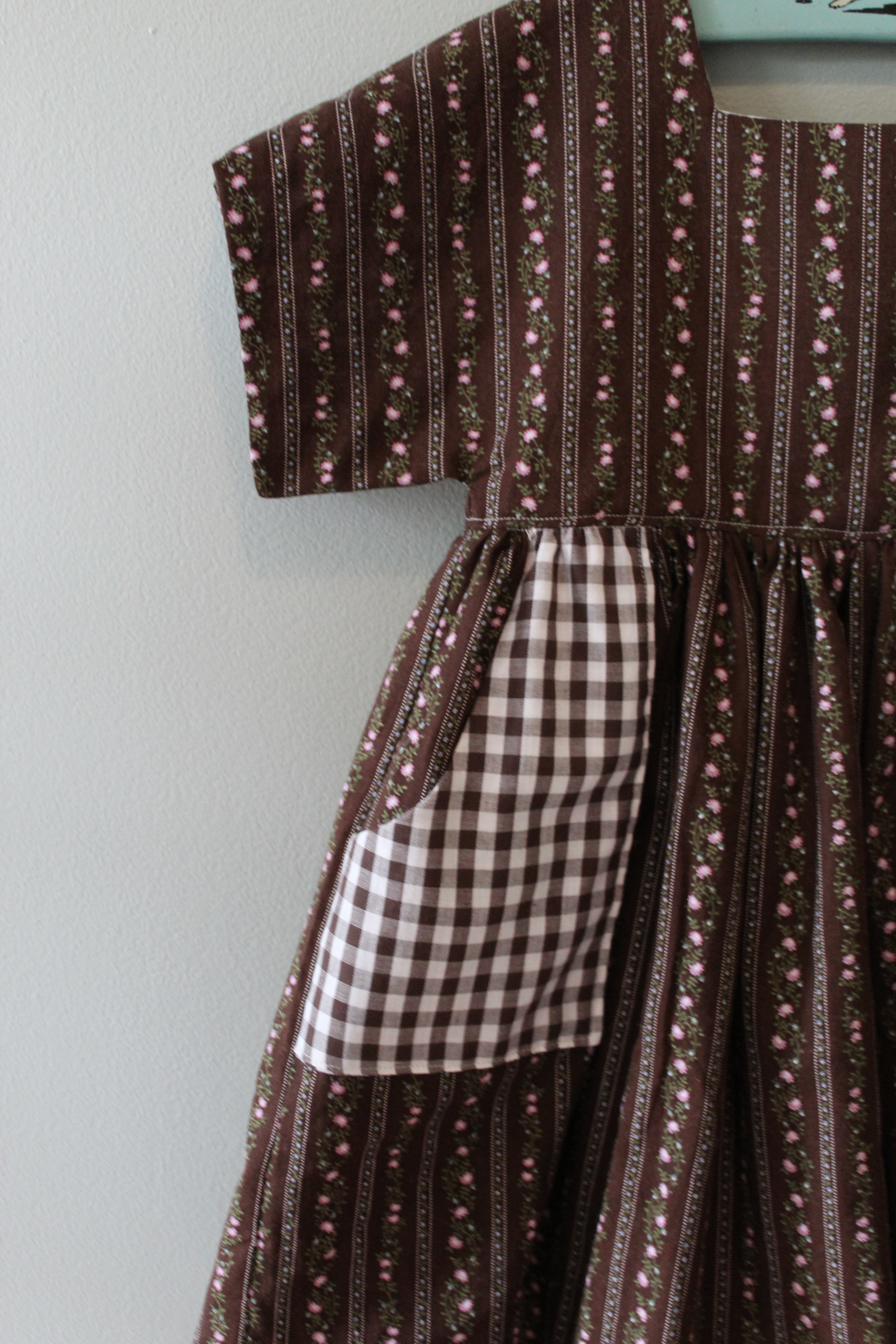 Close-up of a brown patterned fabric with a checkered section.
