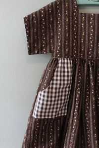 Close-up of a brown patterned fabric with a checkered section.