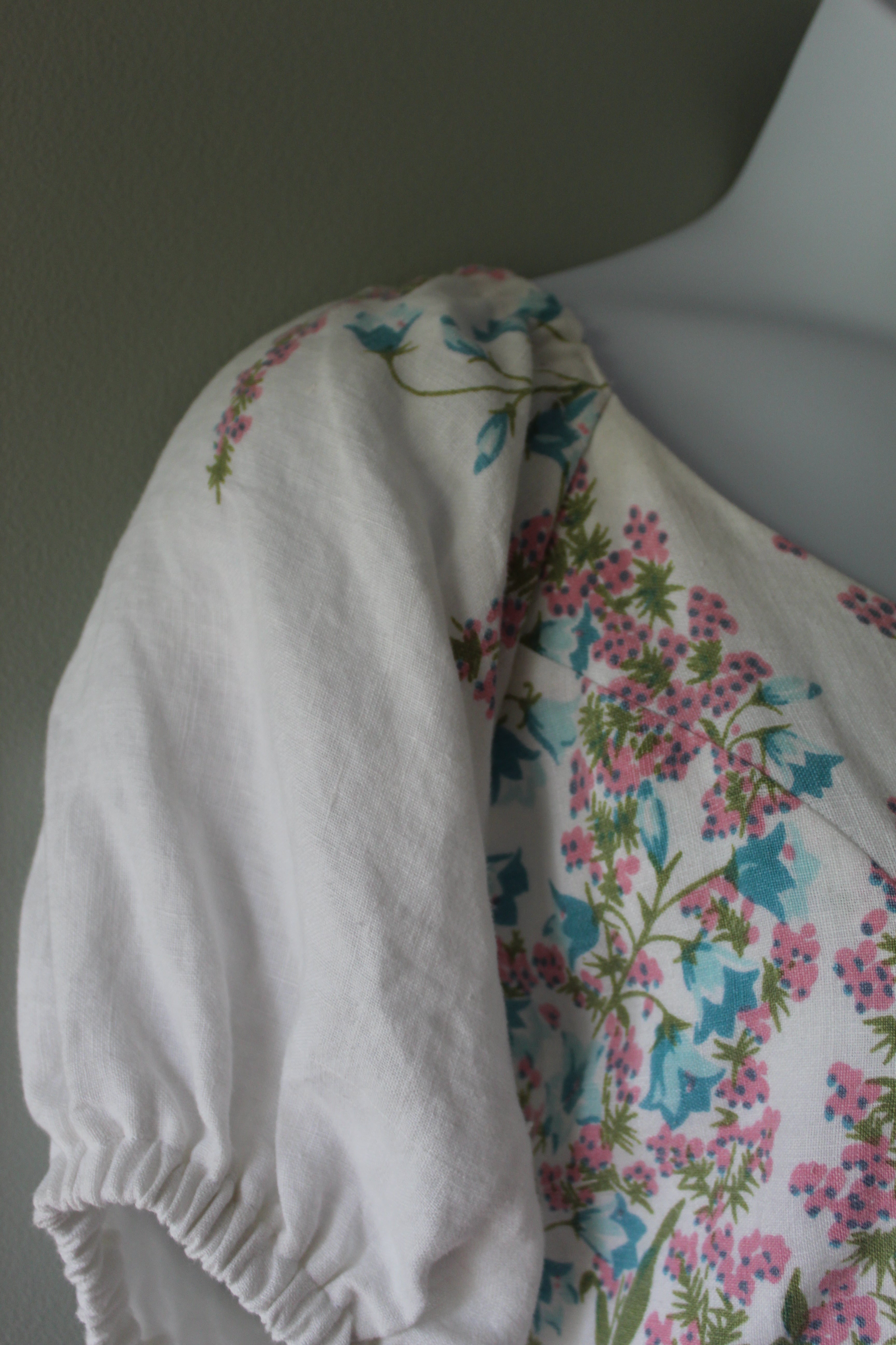 Floral-patterned fabric on a mannequin with a plain background