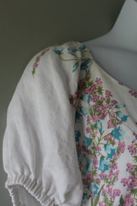 Floral-patterned fabric on a mannequin with a plain background